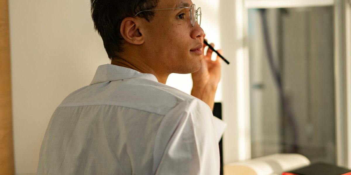 A person deeply thinking about their future career choices and potential paths in the tech industry.