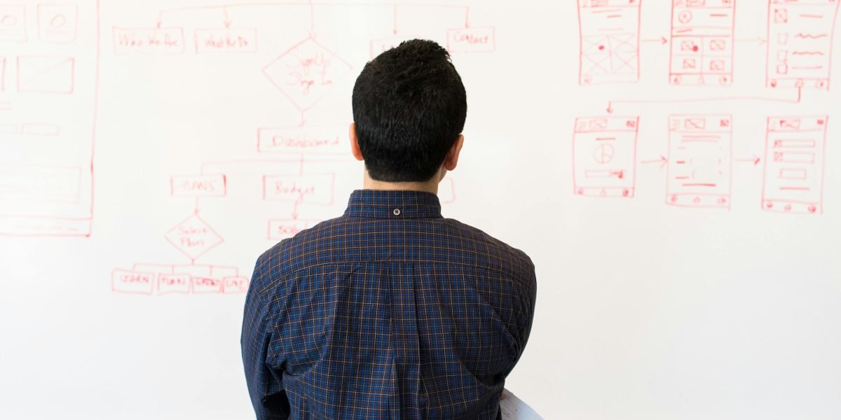 A professional presenting innovative AI development strategies to a team.