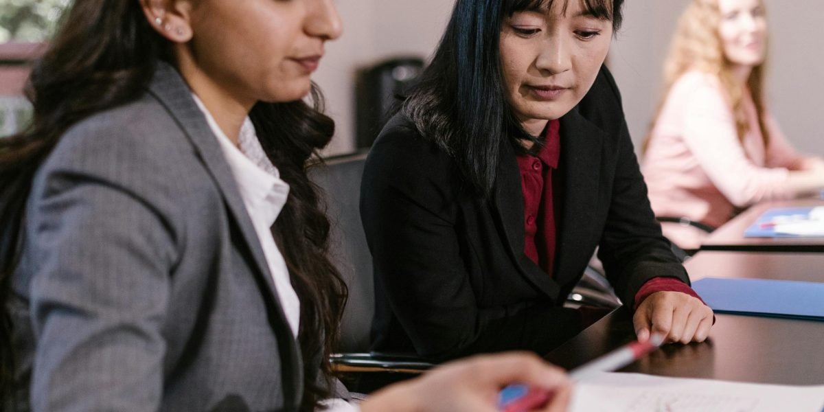 Professionals reviewing legal or compliance documents, emphasizing the importance of governance and regulation.