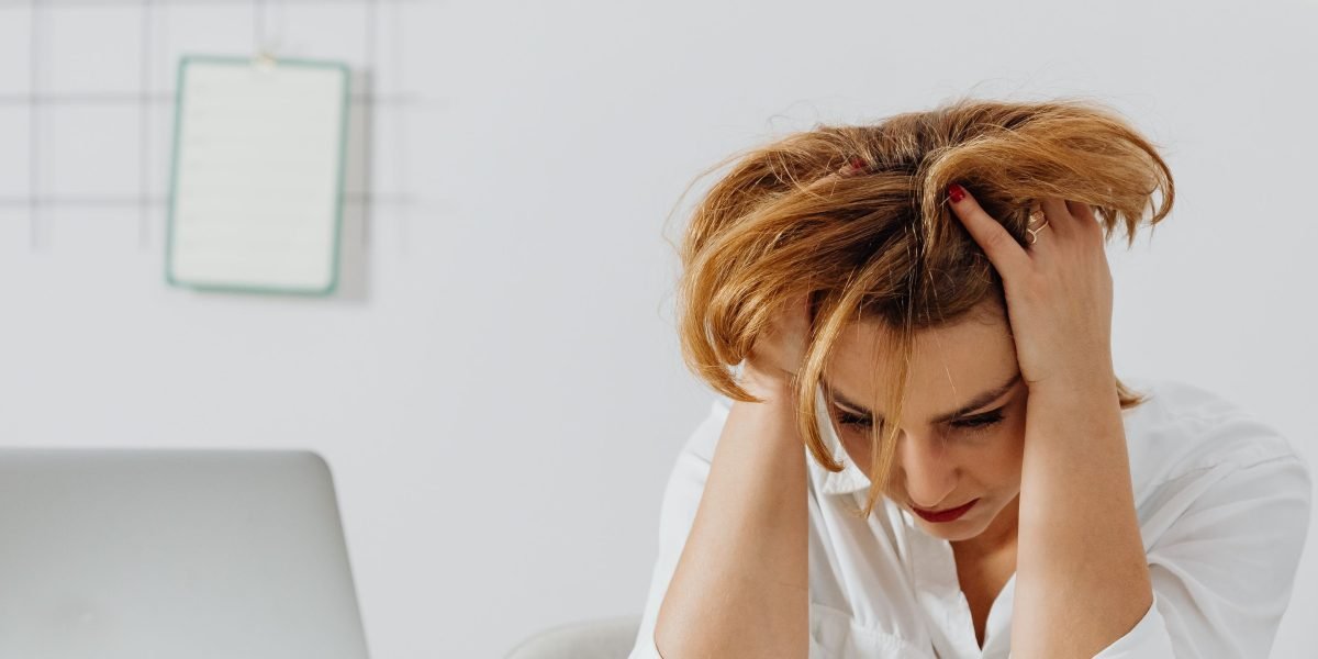 A person looking thoughtful and slightly overwhelmed, reflecting the common feeling when faced with many new AI tools.