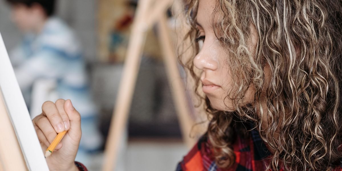 A person intently focused, symbolizing the continuous effort required to master new skills and stay current in technology.