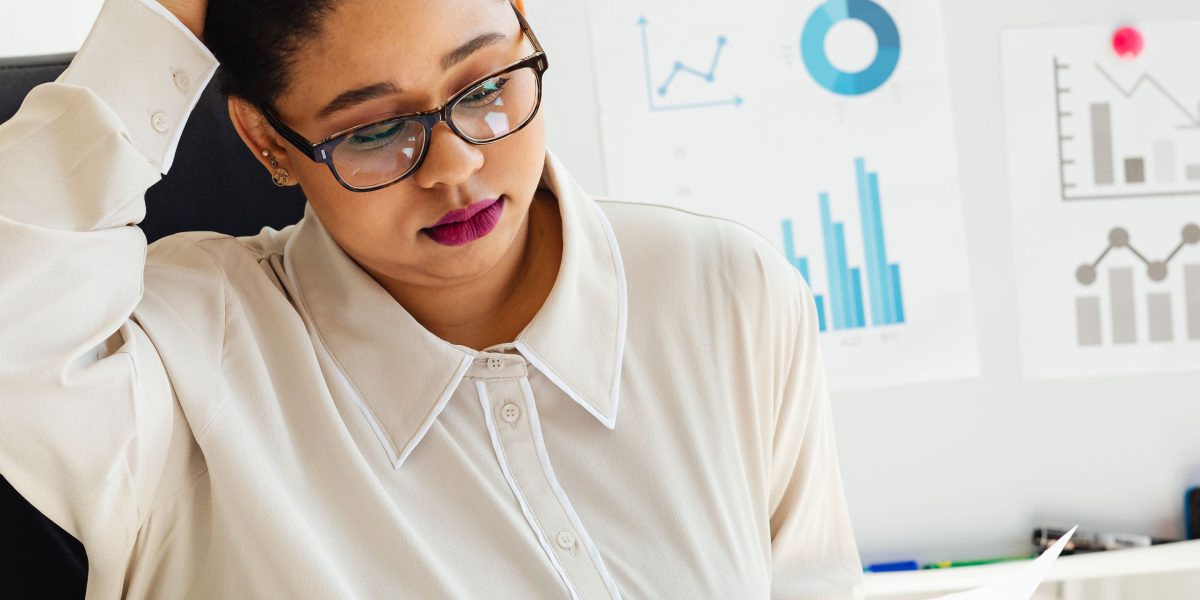 A person thoughtfully considering options, representing the careful decision-making involved in navigating job offers.