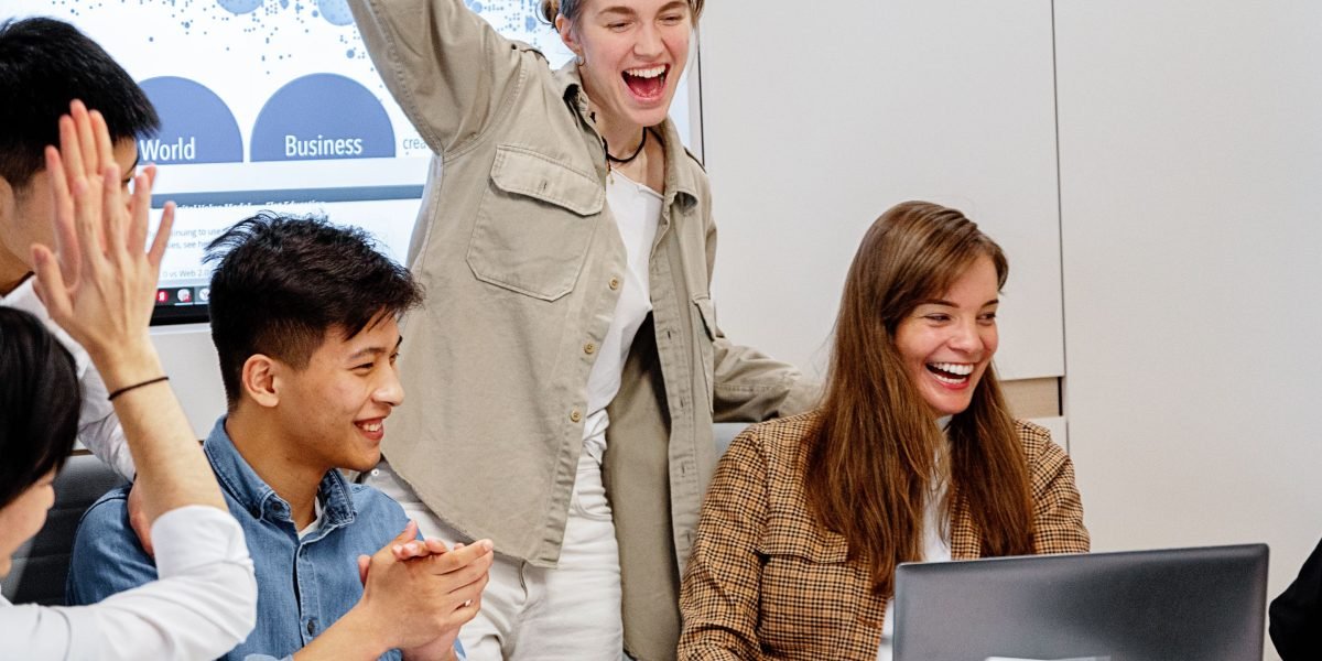 Witness a team celebrating the success of proactive AI-driven testing and observability, ensuring stable and reliable software deployments.