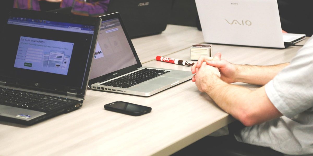 A team diligently reviews security protocols and compliance frameworks to safeguard sensitive code with AI tools.