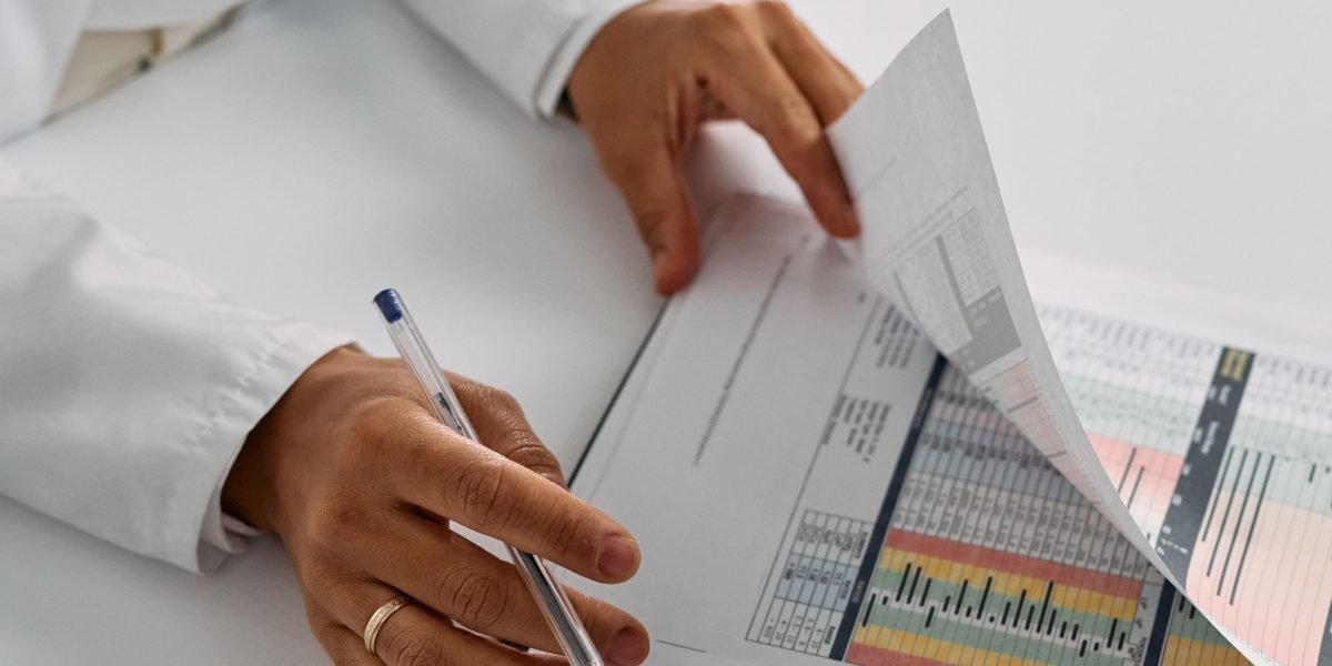 A professional carefully reviewing the outputs or decisions made by an AI system, emphasizing the importance of human oversight.