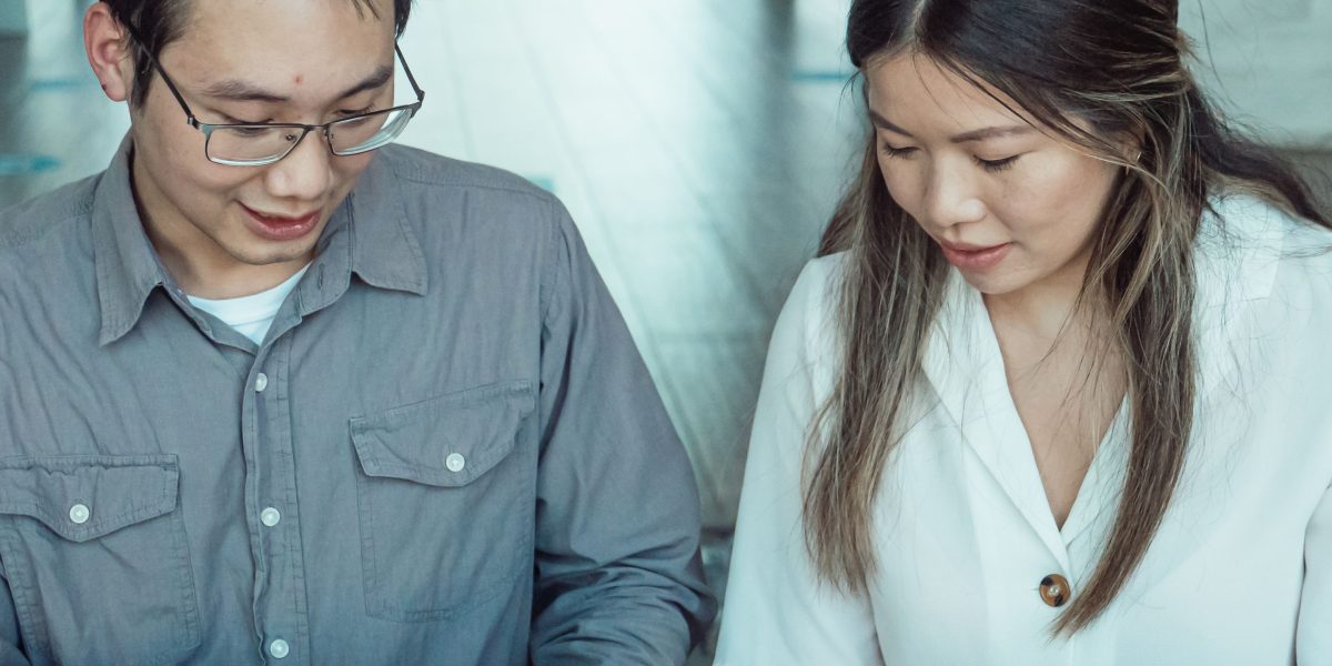 Professionals reviewing strategy documents, symbolizing the careful evaluation and decision-making process when choosing an AI learning platform.