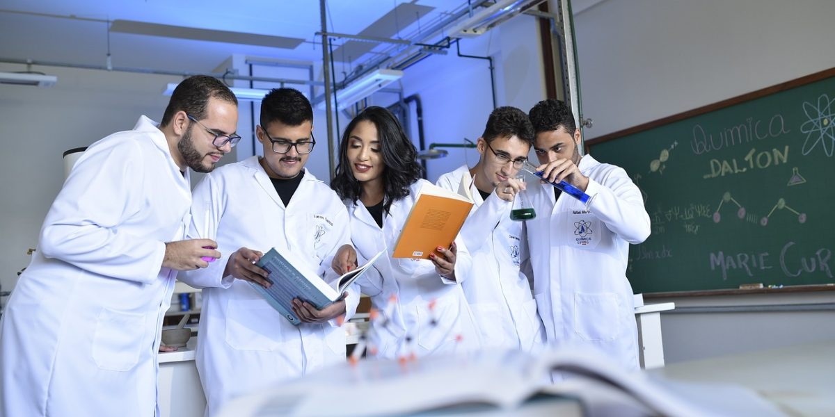 Researchers collaborating in a modern lab environment, symbolizing the origins of AI tools.