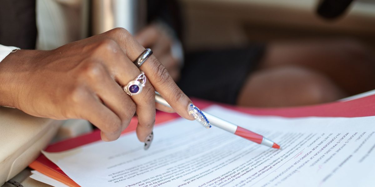 A professional reviewing documents related to AI governance, security, and compliance.