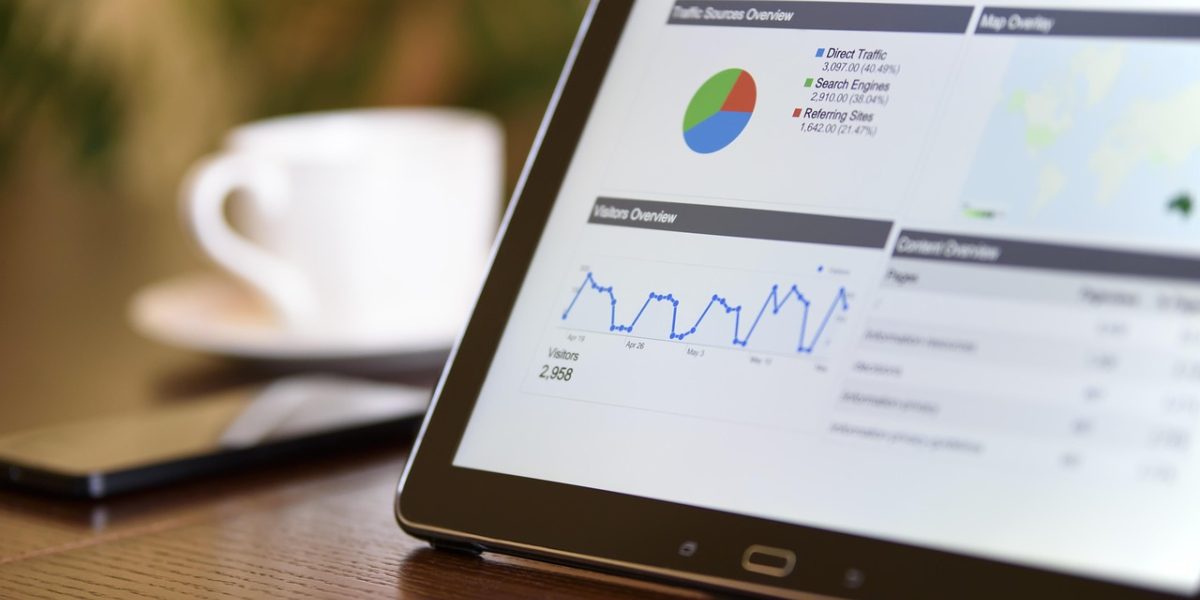 A business team analyzing performance data to demonstrate the return on investment from integrating AI developer tools.