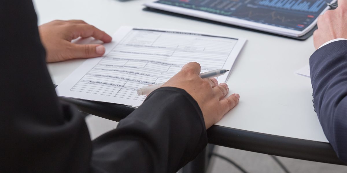 A data analyst presents findings to a team, helping them interpret market signals for strategic decisions.