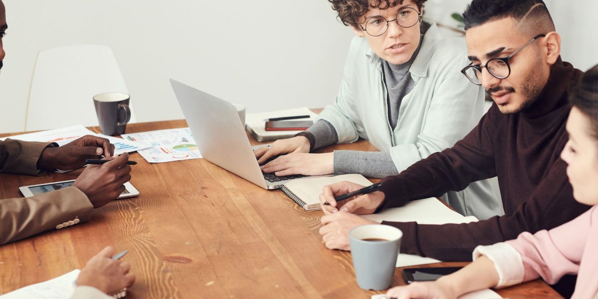 A team deeply focused on a shared project, illustrating the importance of avoiding distractions and maintaining concentration.