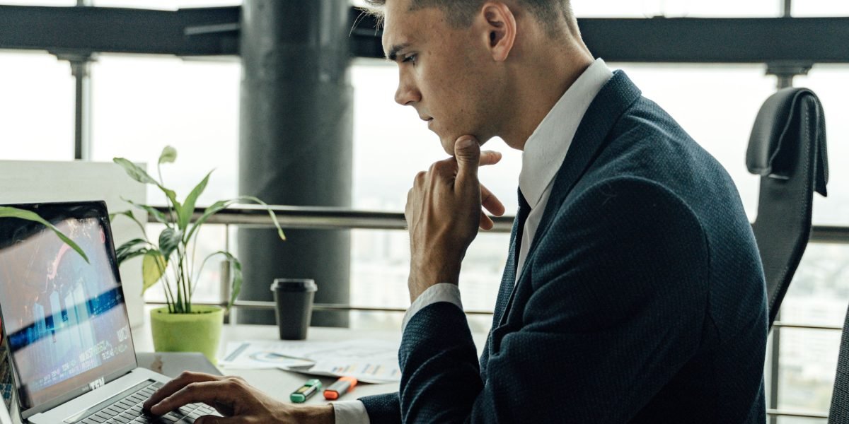 A person thoughtfully considering their career options, representing decisions about remote work, relocation, and compensation.