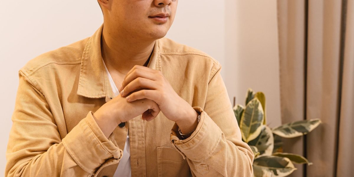 An individual thoughtfully contemplating the broader business strategy and its implications.