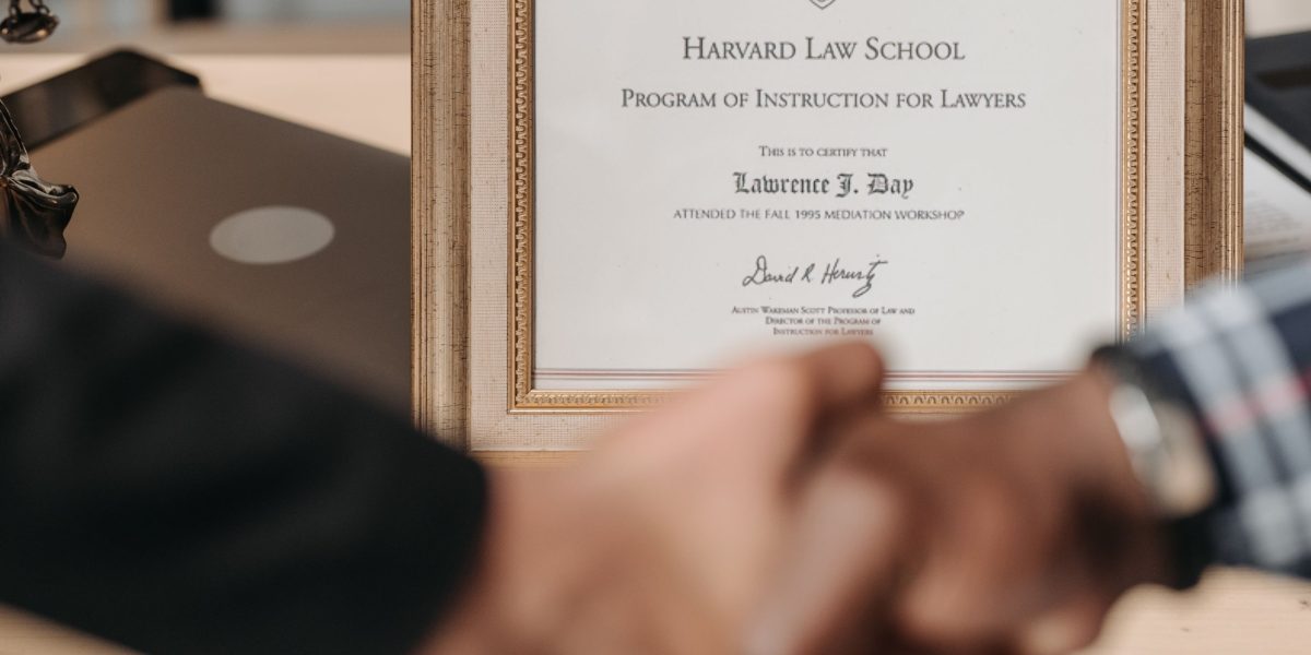 A professional proudly holding a certificate, symbolizing achievement in online learning.