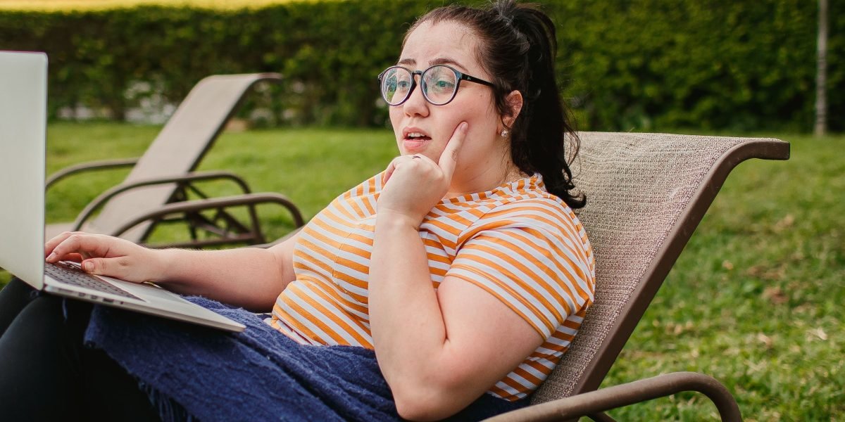 A freelance web developer enjoying the flexibility and independence of remote work, embodying freedom and improved earnings.