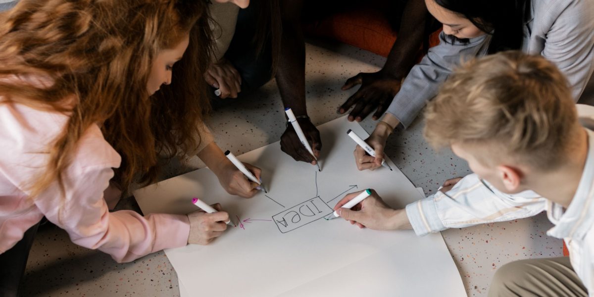 A diverse team collaborating actively, reflecting dynamic market demands and aggressive hiring for skilled professionals.